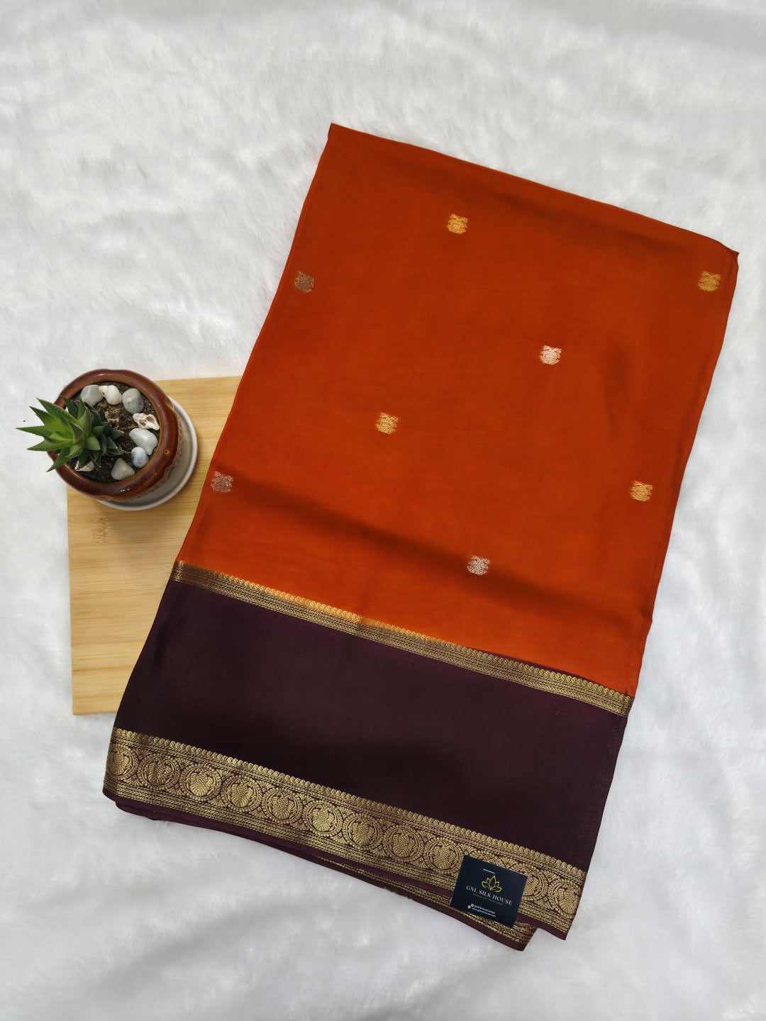 Orange Viscose Silk Saree with Gandaberunda Buttas & Brown Dual Zari Border