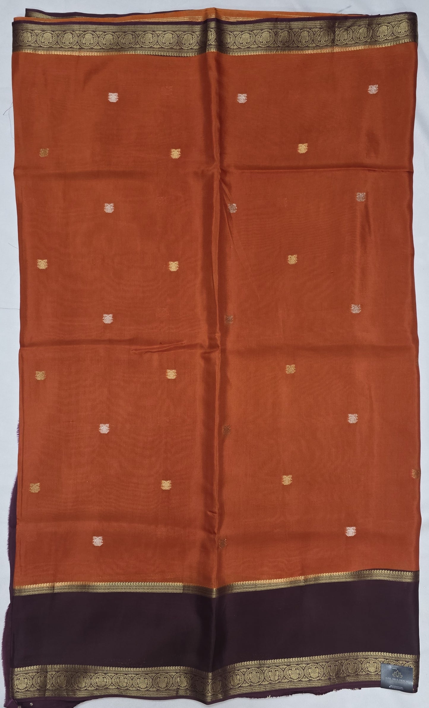 Orange Viscose Silk Saree with Gandaberunda Buttas & Brown Dual Zari Border
